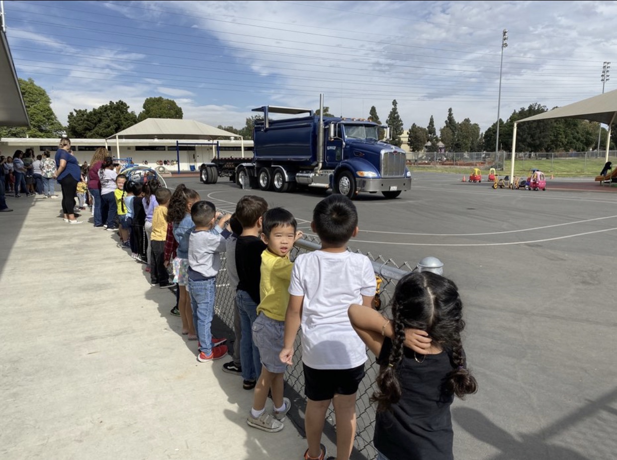 Students lined up to watch a truck show how it works!