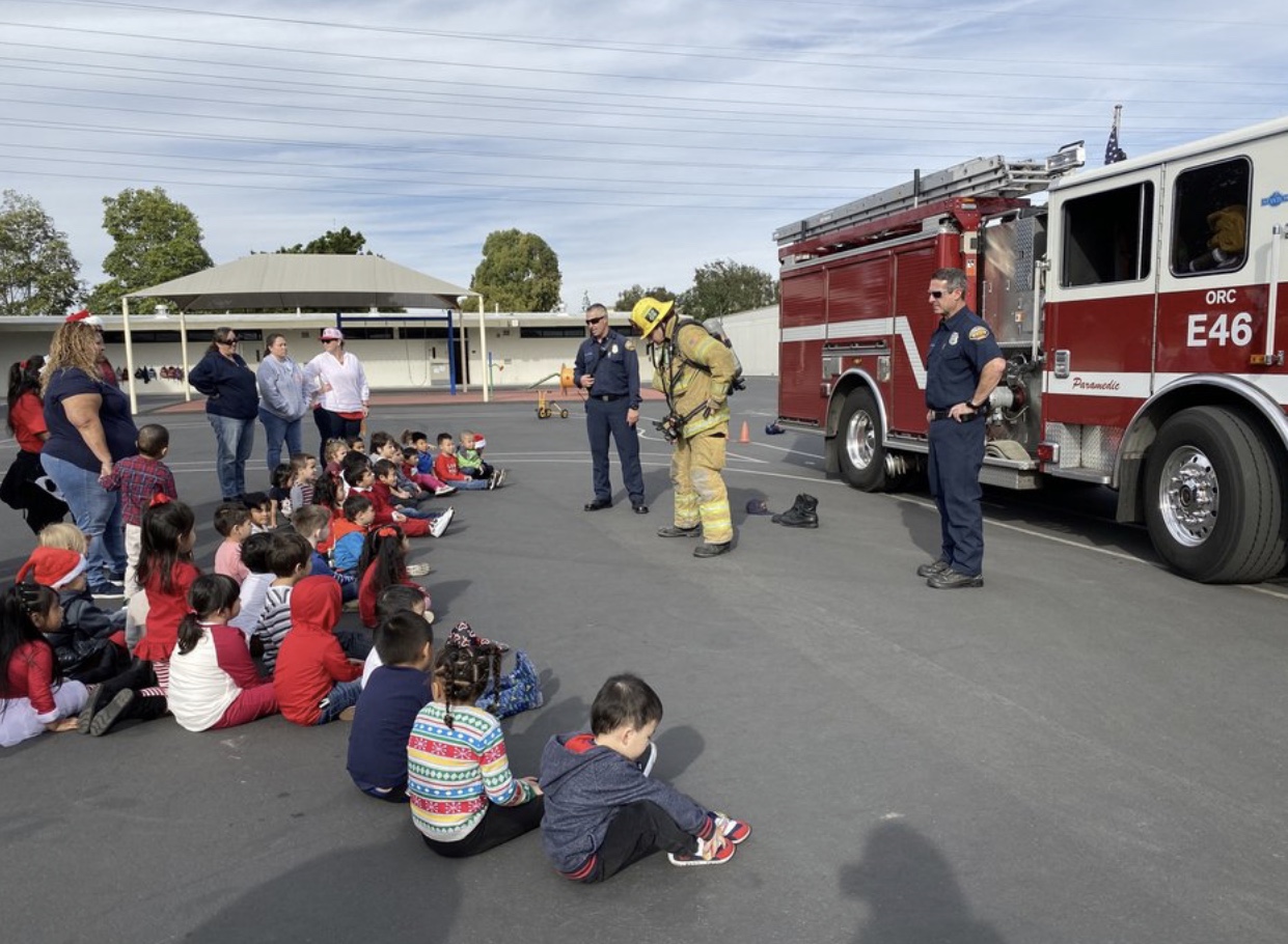 Firemen demonstrating fire fighting gear!