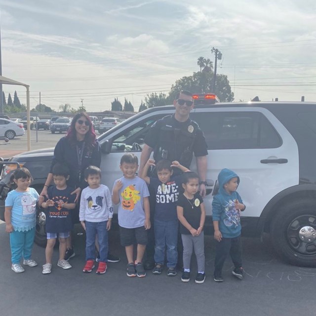 Students taking a picture with a Police Officer.