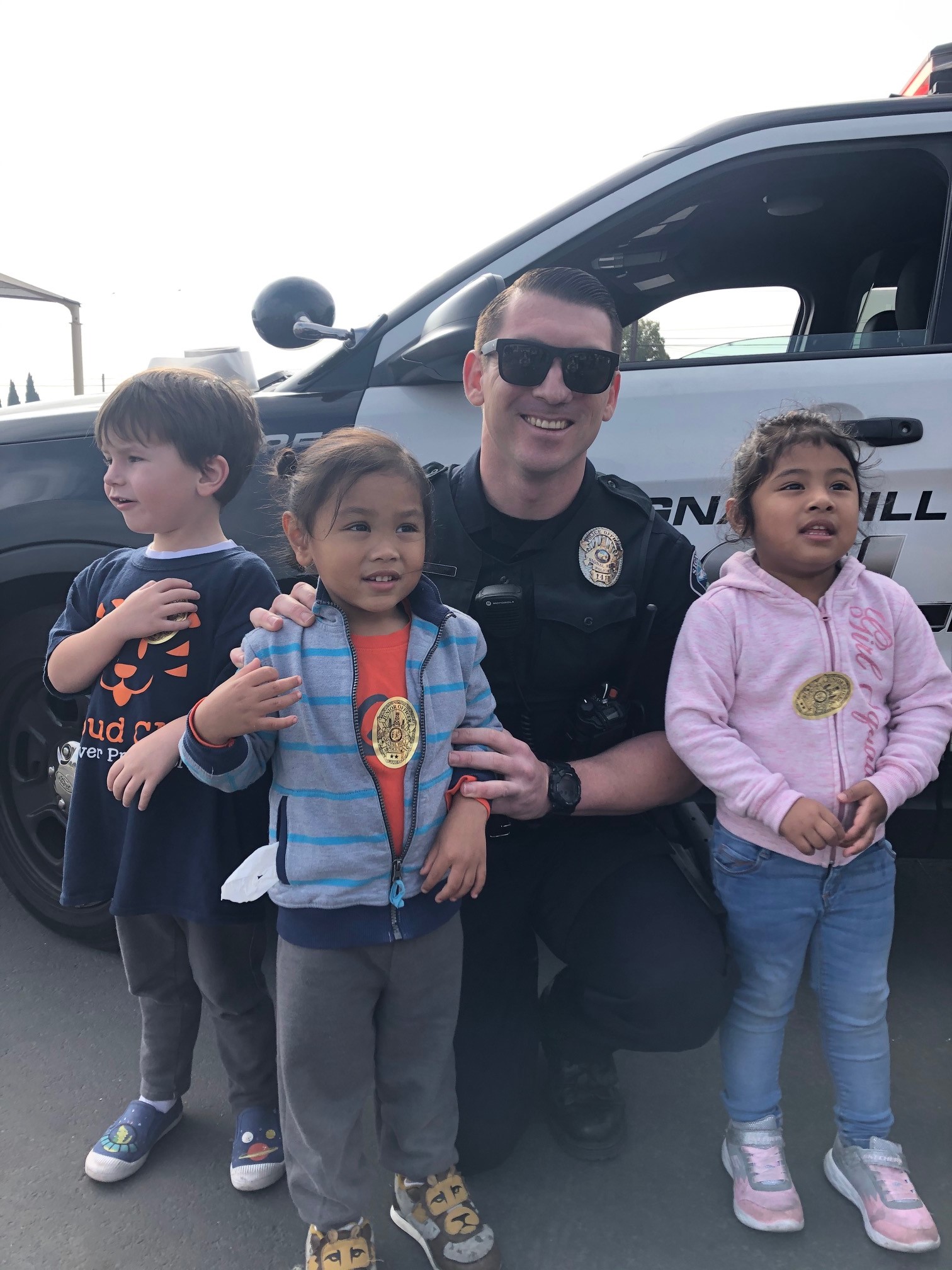 A Police Officer poses for a picture.