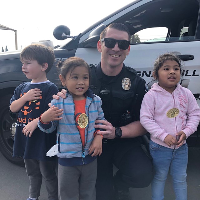 A Police Officer poses for a picture.