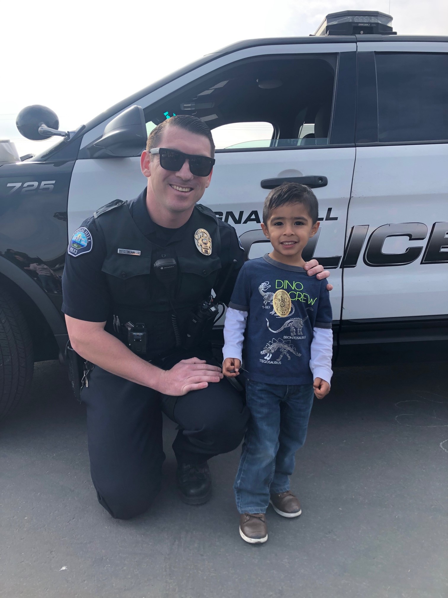 A Police Officer poses for a picture.